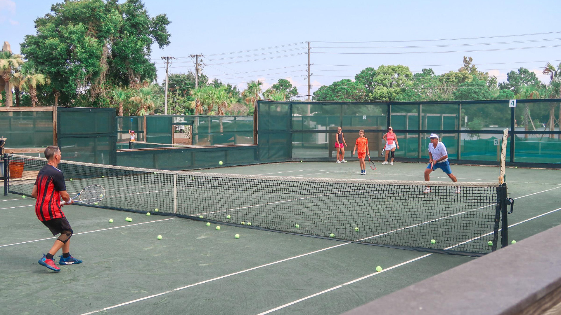 teams playing on the tennis courts